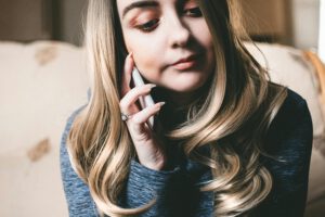 Customer on hold — replaced by Pro-How AI phone agent that answers calls 24/7