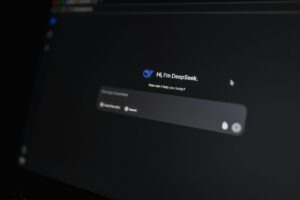 AI prompting interface on computer screen showing DeepSeek chatbot greeting and message input, illustrating how small businesses can use AI tools for better prompts and productivity